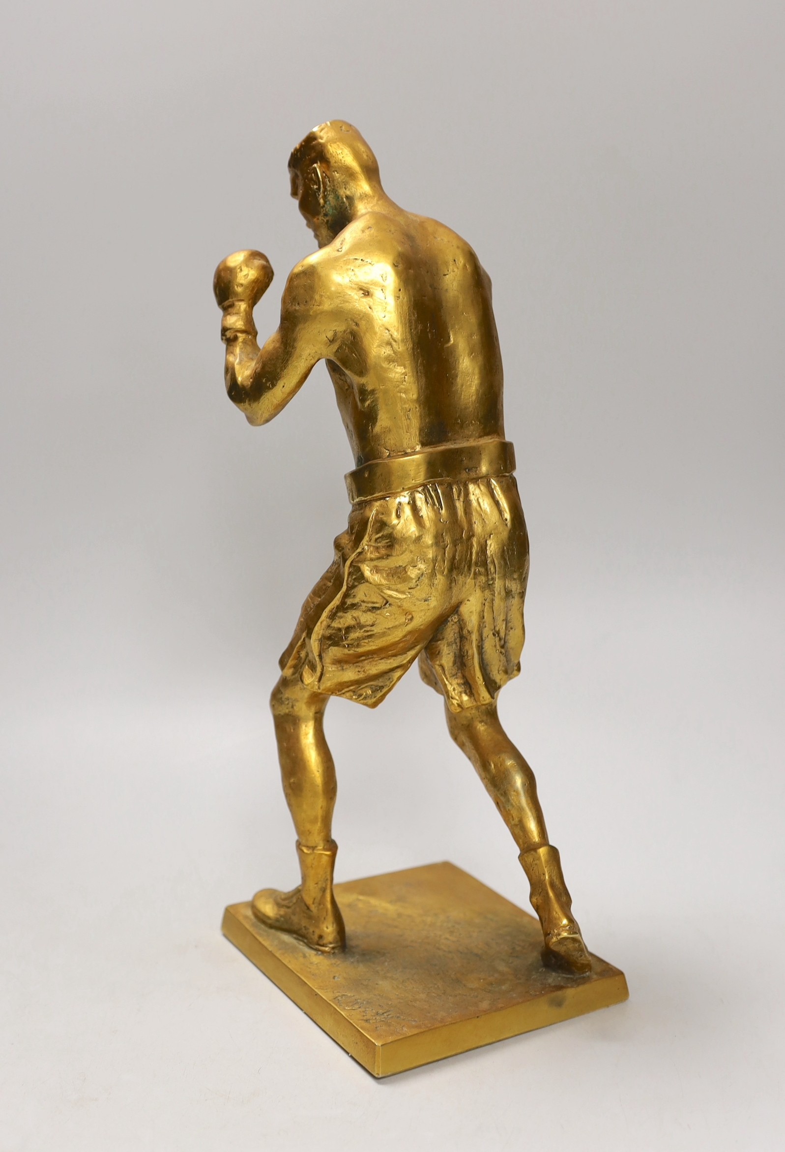 A cast bronze figure of boxer Andrew Golota, signed. 35cm tall